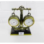 A desk clock and barometer mounted on a anchor base, 21 x 16cm