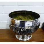 A silver plate on copper planter with stylised leaf pattern in relief