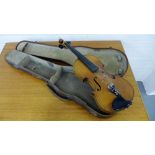 A Violin in a leather fitted case