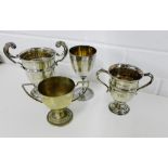 Two Birmingham silver twin handled trophy cups dated, 1922 and 1924, tallest 14.5cm high, together