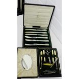 A cased set of six silver handled fruit knives, retailed by Mappin & Webb together with a bone