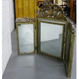 A silver gilt triple dressing mirror with a carved frieze to top and with Greek key borders, 73 x