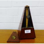 A French mahogany cased metronome, 23cm high