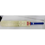 A 1994 commemorative cricket bat bearing full team signatures from both the England and South Africa