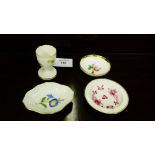 Three small Meissen trinket dishes painted with flowers together with a Meissen egg cup, (4)
