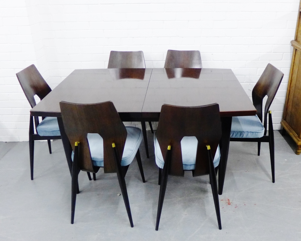 A retro Meredew dining suite comprising a set of six dining chairs with shaped backs and blue