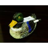 An early 20th century Portuguese Majolica tureen and cover, modelled as a duck, complete with its