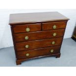 A 19th century mahogany chest, the rectangular top with moulded edge, over two short drawers and