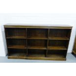 An oak open bookcase on plinth base, 108 x 184cm