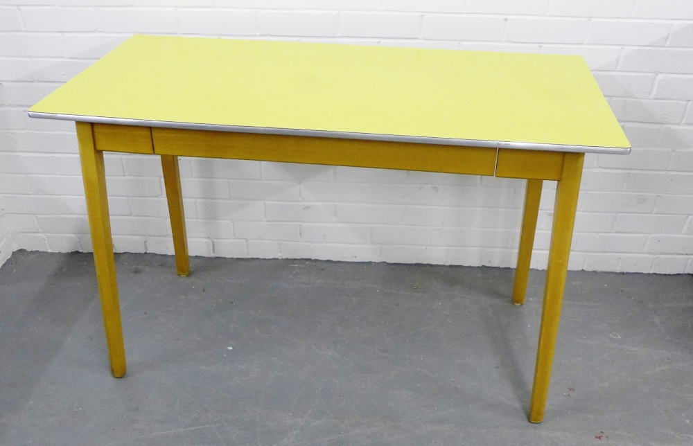 A retro yellow Formica topped pine kitchen table, 77 x 122cm