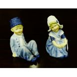 A pair of bisque blue painted Heubach Dutch boy and girl figures, 23cm high, (2)