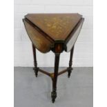 A rosewood and inlaid drop flap table, on tripod turned and tapering supports, 74cm high