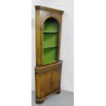 A floor standing mahogany corner cabinet, fitted with two open shelves, over a cupboard base, 180