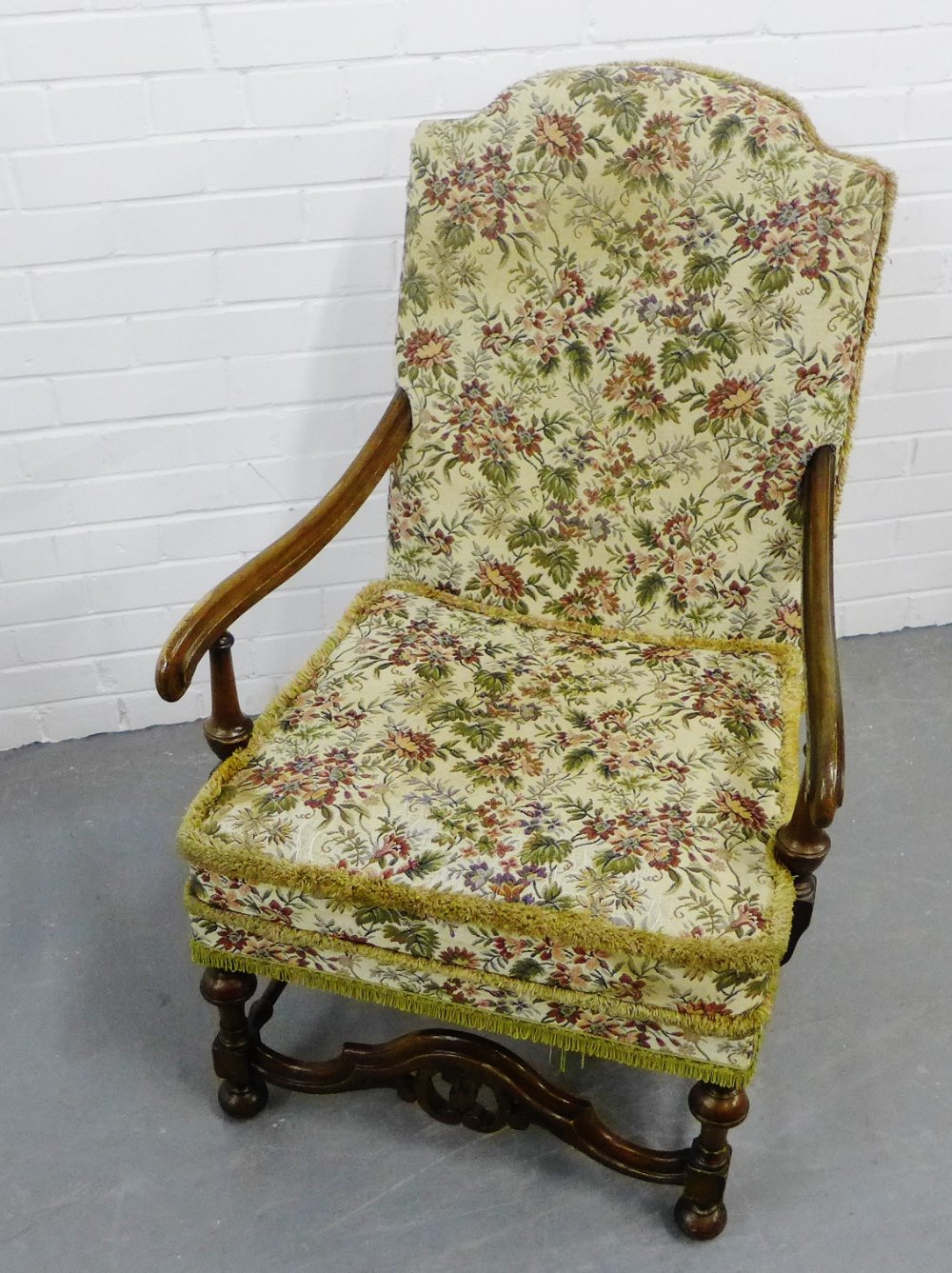 A walnut framed and floral upholstered open armchair, 102 x 66cm