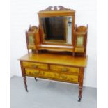 A mahogany and burrwood dressing table, the central mirror flanked by cupboards and short drawers,