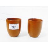 A pair of polished Yixing stoneware beakers, with impressed mark to base, 7cm high, (2)