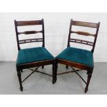 A pair of mahogany side chairs with horizontal splats and slip in upholstered seat, on turned