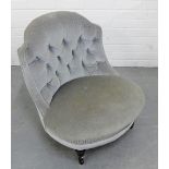 An upholstered button back bedroom chair with brass castors, 64 x 60cm