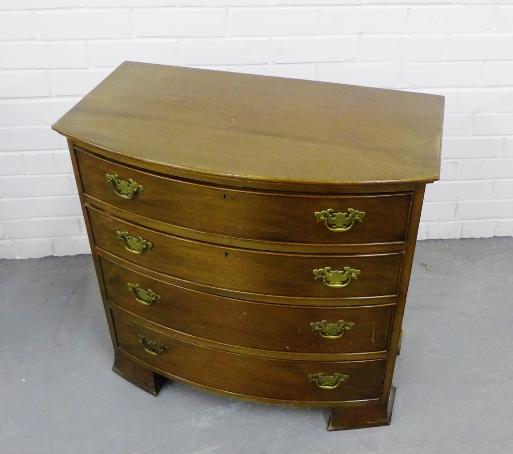 A mahogany bow fronted chest with four long graduating drawers, raised on bracket feet, 70 x 72cm