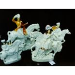 A collection of four Staffordshire equestrian and rider flat backs to include 'Returning Home'