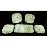 A Burleigh Art Deco honey glazed sandwich set painted with butterflies and flowers within a black