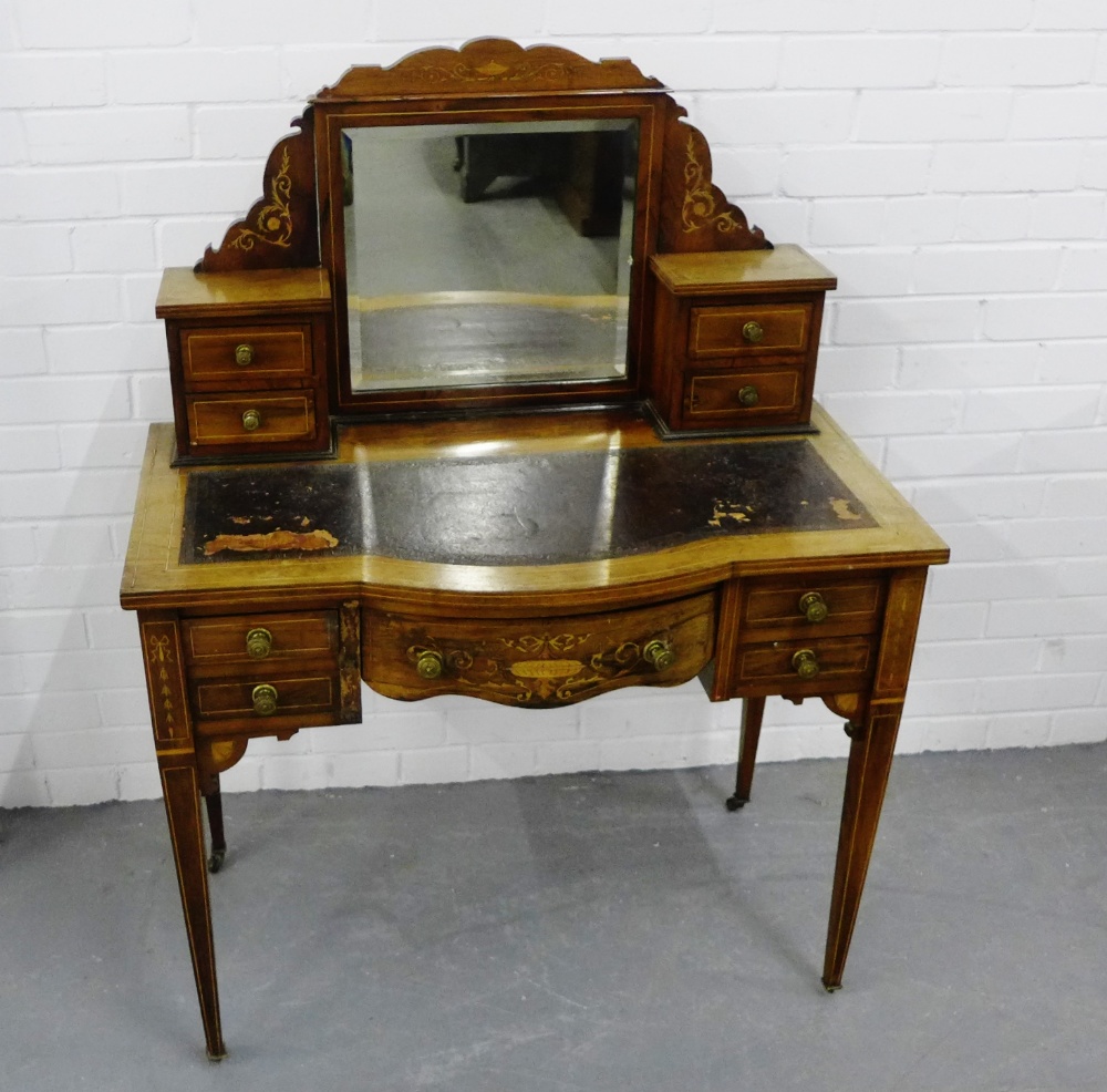 A 19th century rosewood and inlaid dressing table, the shaped top over a central mirror flanked by