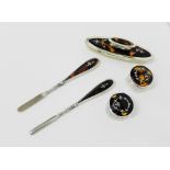 George V silver, tortoiseshell and pique work manicure items to include a nail buffer, nail and