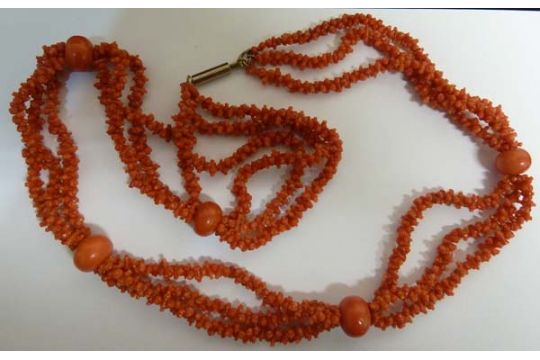 An unusual antique coral bead necklace, c1880, composed of three rows of natural formed deep red