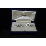 A pair of 15ct gold Mappin & Webb cufflinks, mounted in mother of pearl with turquoise cabouchons to