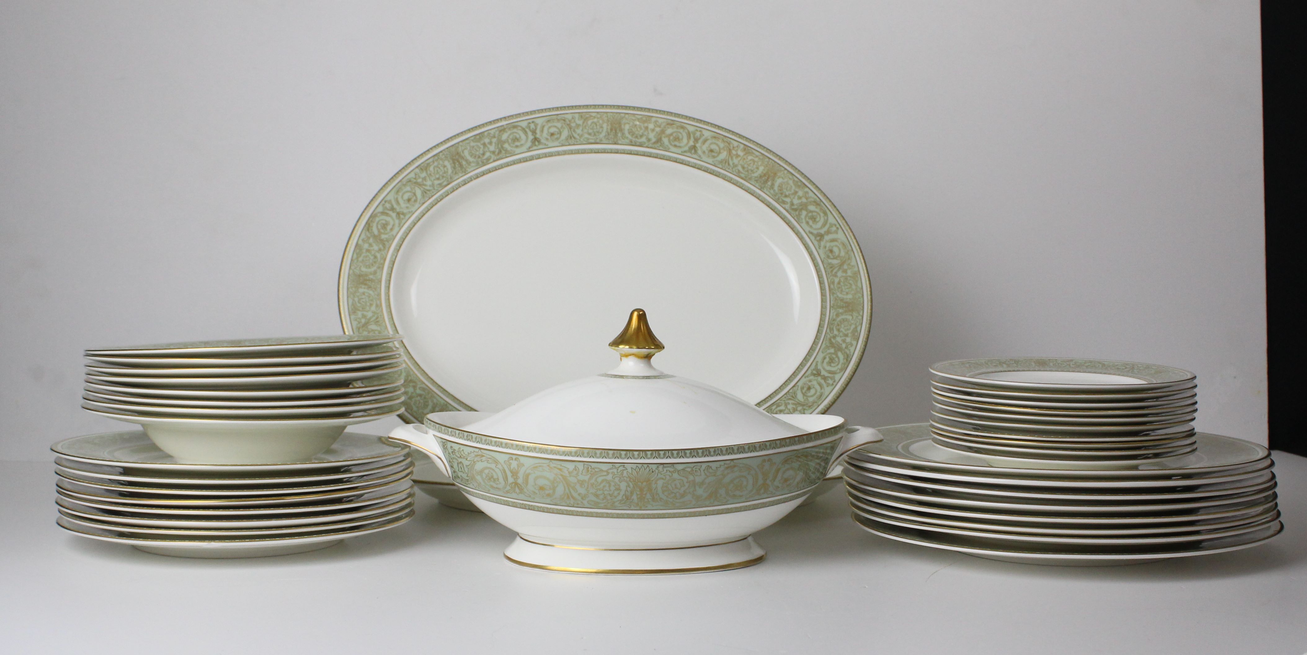 A Royal Doulton English Renaissance pattern dinner service, pale green ground, comprises eigh dinner