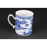 A Chinese export porcelain mug or tankard, painted in blie with pagodas and boats in a river