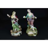 A pair of English porcelain candelabra figures, modelled as a Lady and Gallant on rococo scroll