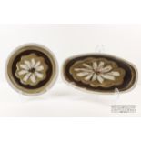 Marianne de Trey - two pottery platters, decorated with a daisy motif within banding, 37.5cm max. (