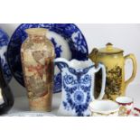 A group of decorative ceramics including stone ware tea wares of brown glaze sprigged with white
