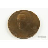 A bronze medallion, Katherine Mansfield, 1888-1923, bust to one side,
