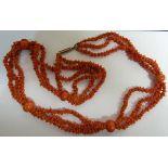 An unusual antique coral bead necklace, c1880, composed of three rows of natural formed deep red