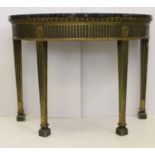 A green and gilt gesso printed demi-lune table, deep line gadrooned apron over fluted legs, the