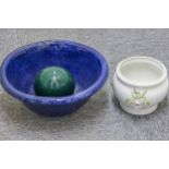 A large blue pottery bowl; a decorative pottery ball; and a jardiniere (3)