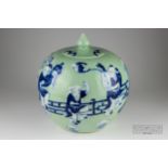 A Chinese porcelain celadon ground blue and white jar and cover, globular decorated with figures,