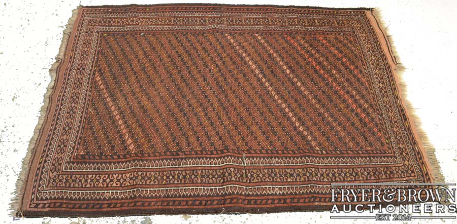 A Northwest Frontier Persian rug, probably Kazak, the central reserve of diagonal striped within