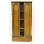 A 19thC library pedestal bookcase, two sides with adjustable shelves, two with reserved beaded
