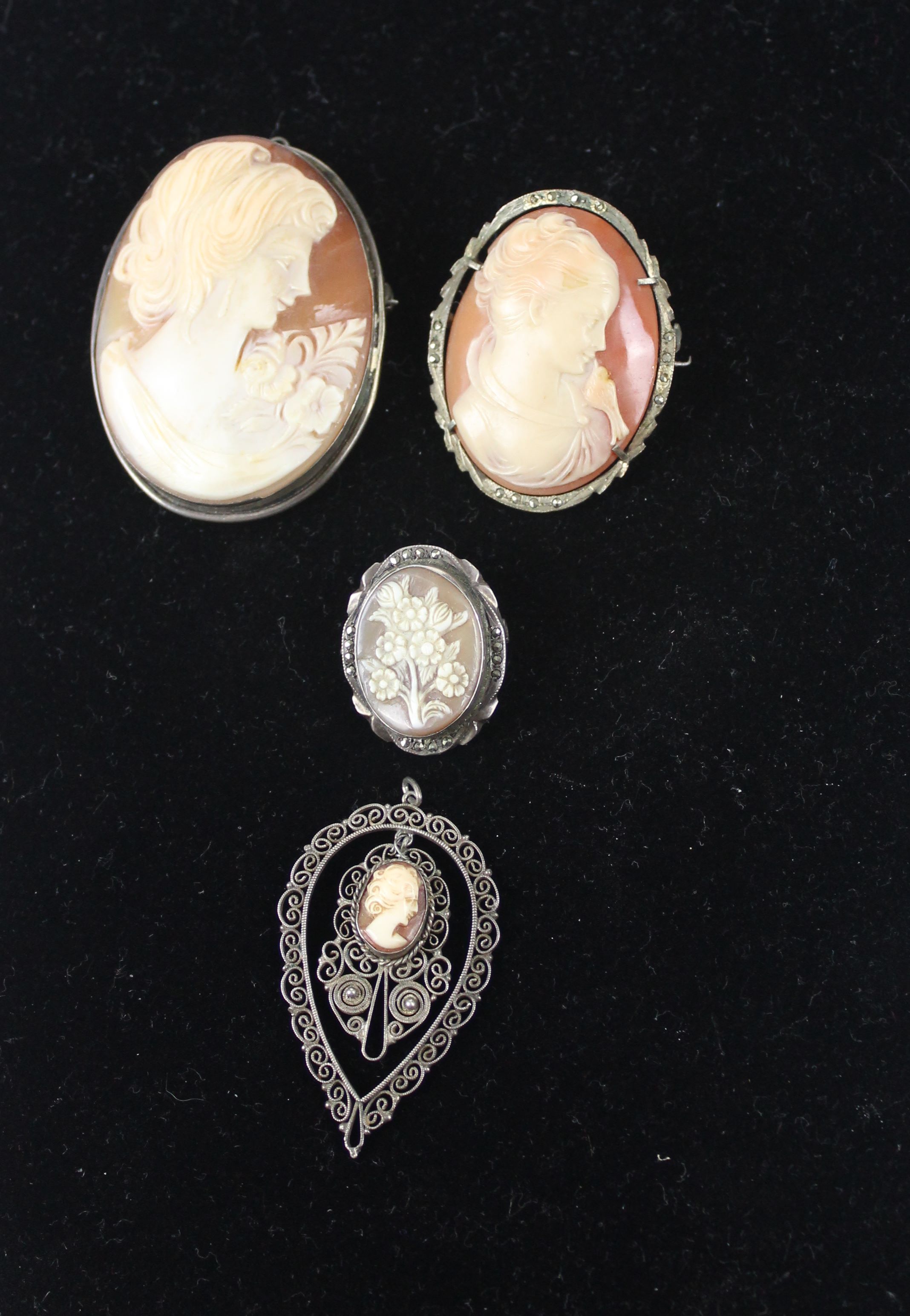 Three vintage carved shell cameo brooches, c1950; and a shell cameo pendant mounted in silver