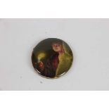 A German porcelain oval plaque, Good Night, a young girl holding a candle peeping out from a