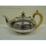 An antique silver teapot by George Burrows, London, 1821