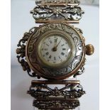 An unusual French silver and gold ladies wrist watch, c1880, the circular white enamel dial with