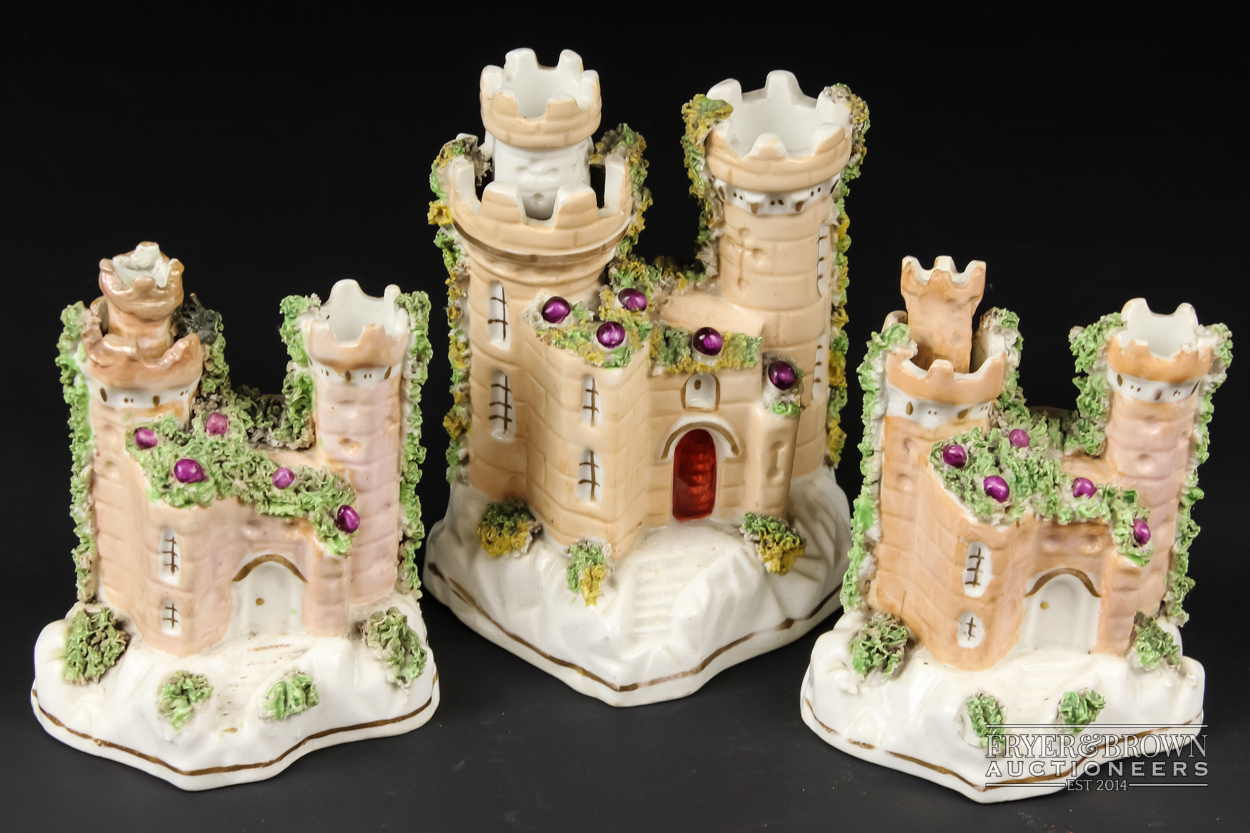 Three Staffordshire porcelain pastille burners in the form of castles, applied mosswork, 12.5cm high