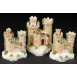 Three Staffordshire porcelain pastille burners in the form of castles, applied mosswork, 12.5cm high