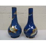 A pair of Wedgwood ordinary lustre bottle vases, printed in gilt and decorated in polychrome