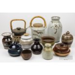 A group of studio pottery, including a swing handle storage jar, marked Chris Aston ELKESLEY