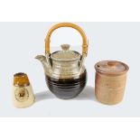 Three items of studio pottery, comprises Mulcheny storage jar and cover; Bob Dawe; and a tea